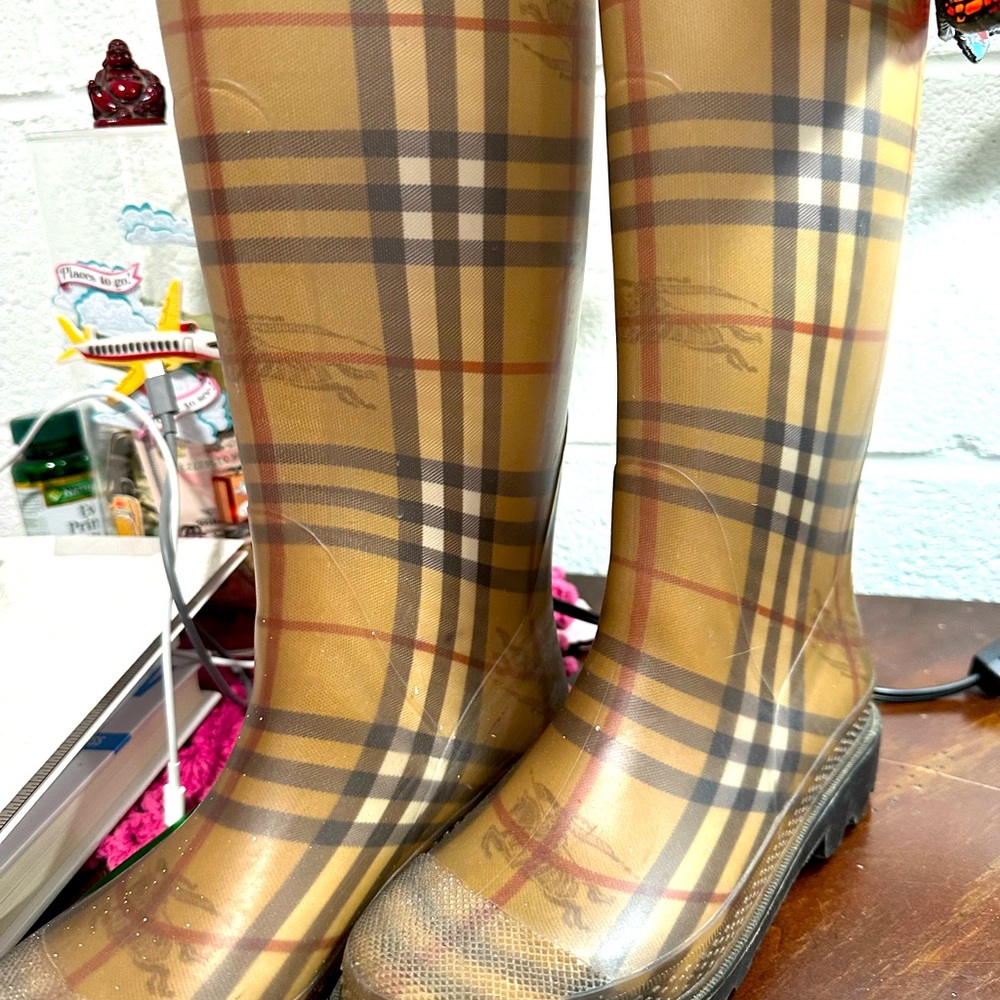 Burberry brown rain boots.